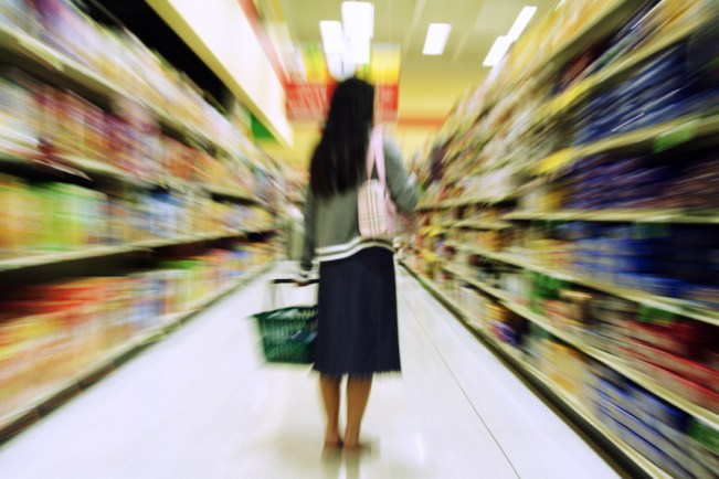 A woman shopping in a grocery store